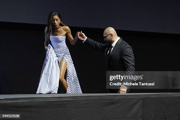 Actor Dave Bautista helps Actress Naomie Harris , to step on stage during the swiss premiere of 007, James Bond Film "Spectre" October 27, 2015 at...