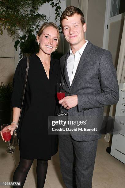 Ed Speleers and Asia Macey attend the COS Dinner At Spring at Spring at Somerset House on October 27, 2015 in London, England.