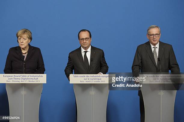 German Chancellor Angela Merkel, French President Francois Hollande and European Commission President Jean-Claude Juncker attend a joint statement...