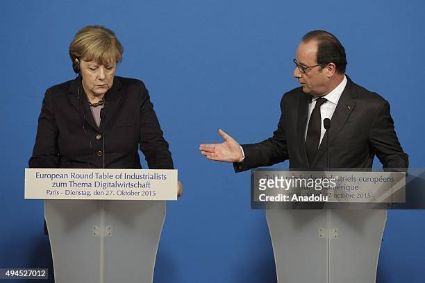German Chancellor Angela Merkel and French President Francois Hollande deliver a joint statement a joint statement after the France-Germany digital...