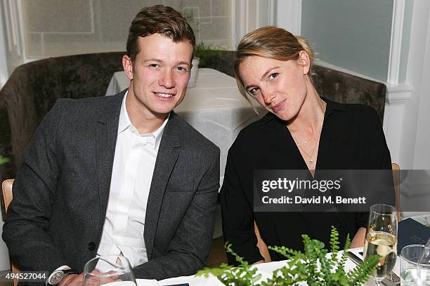 Ed Speleers and Asia Macey attend the COS Dinner At Spring at Spring at Somerset House on October 27, 2015 in London, England.