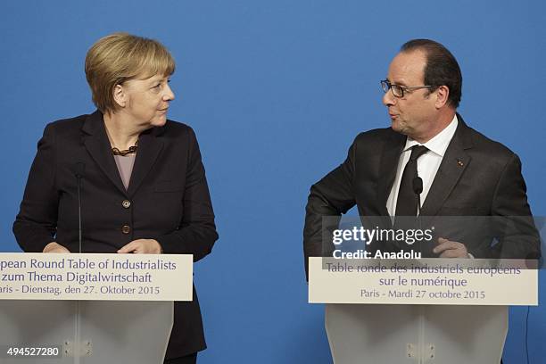 German Chancellor Angela Merkel and French President Francois Hollande deliver a joint statement a joint statement after the France-Germany digital...