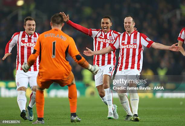 Stoke City players Jack Butland, Xherdan Shaqiri, Peter Odemwingie and Charlie Adam celebrate after winning the penalty shoot-out 5-4 during the...