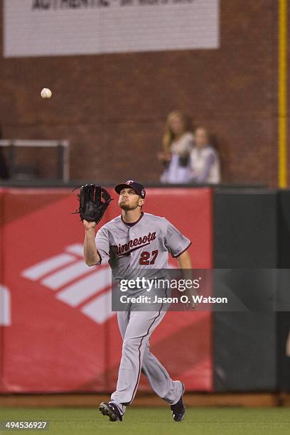 Chris Parmelee of the Minnesota Twins fields a fly ball hit off the bat of Brandon Crawford of the San Francisco Giants during the fourth inning at...