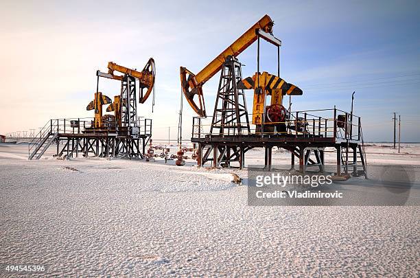 oil rig back light - crude oil stock pictures, royalty-free photos & images