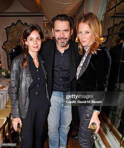 Guest, Roland Mouret and Tilly Wood attend the drinks and dinner at Daphne's to celebrate the Robert Clergerie Walton Street store launch hosted by...