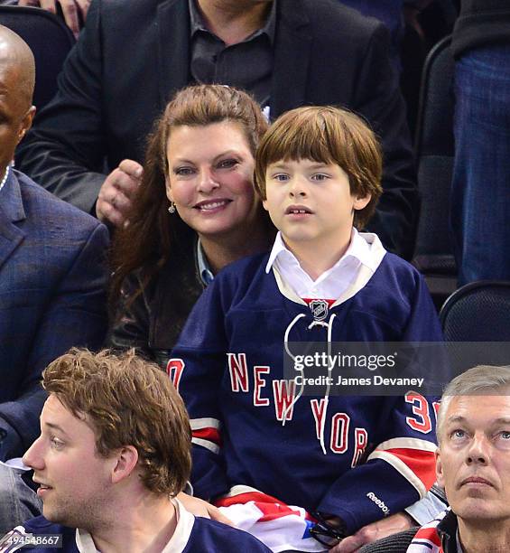 Linda Evangelista and her son Augustin James Evangelista attend Montreal Canadiens vs New York Rangers playoff game at Madison Square Garden on May...