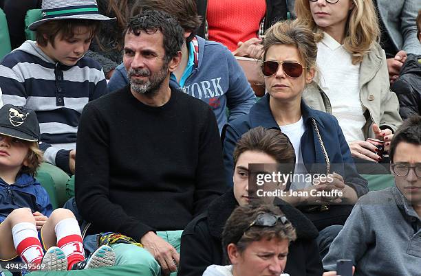 Eric Lartigau and Marina Fois attend Day 5 of the French Open 2014 held at Roland-Garros stadium on May 29, 2014 in Paris, France.