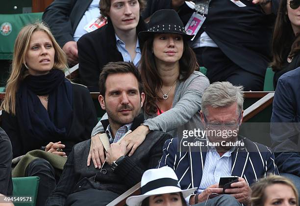 Christophe Michalak and his wife Delphine McCarty attend Day 5 of the French Open 2014 held at Roland-Garros stadium on May 29, 2014 in Paris, France.