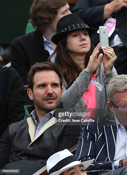 Christophe Michalak and his wife Delphine McCarty attend Day 5 of the French Open 2014 held at Roland-Garros stadium on May 29, 2014 in Paris, France.