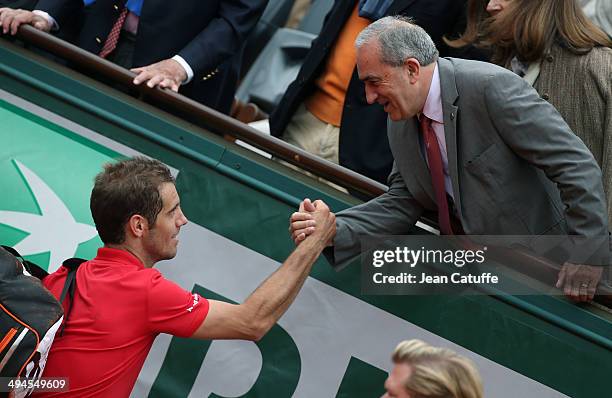 Jean Gachassin, president of the French Tennis Federation congratulates Richard Gasquet of France after his victory on Day 5 of the French Open 2014...