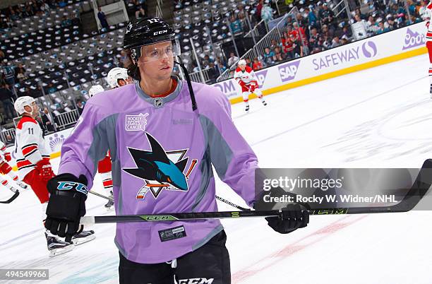 John McCarthy of the San Jose Sharks wears a lavender jersey in support of the Hockey Fights Cancer campaign prior to the game against the Carolina...