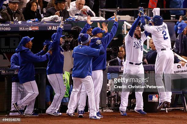 Alcides Escobar of the Kansas City Royals celebrates with teammates after hitting an inside-the-park home run in the first inning against the New...