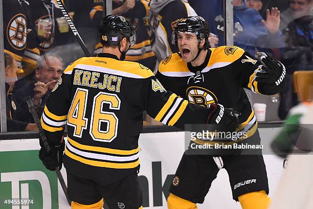 David Krejci and Brett Connolly of the Boston Bruins celebrate a goal against the Arizona Coyotes at the TD Garden on October 27, 2015 in Boston,...