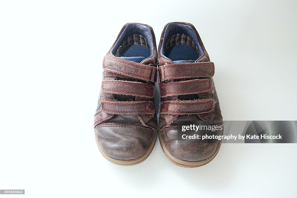 Old small brown boys shoes