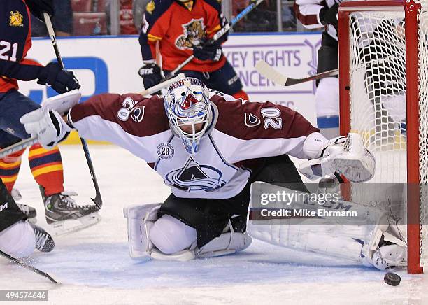 Reto Berra of the Colorado Avalanche makes a stop during a game against the Florida Panthers at BB&T Center on October 27, 2015 in Sunrise, Florida.