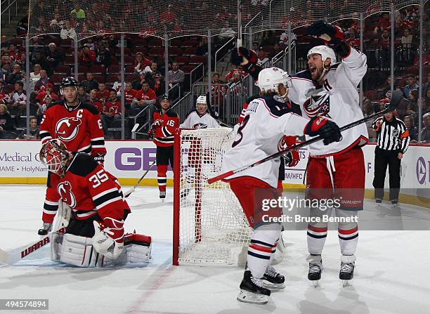 Cam Atkinson of the Columbus Blue Jackets scores at 9:38 and is joined by Brandon Dubinsky in their game against the New Jersey Devils at the...