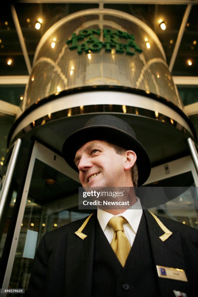 A concierge outside the Copthorne Tara Hotel in Kensington, London.