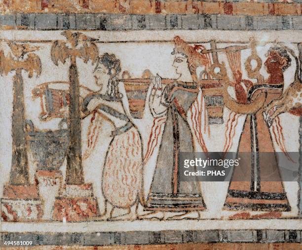 Minoan Art. Crete. The Hagia Triada Sarcophagus. Painted with scenes from Cretan life. Ritual. Bull sacrifice. Woman wearing a crown is carrying two...