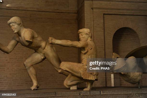 East Pediment's Group of the Temple of Aegina. Ca. 490 BC. First battle of Greeks and Trojans. Helper, kneeling archer, Herakles, and a injured...
