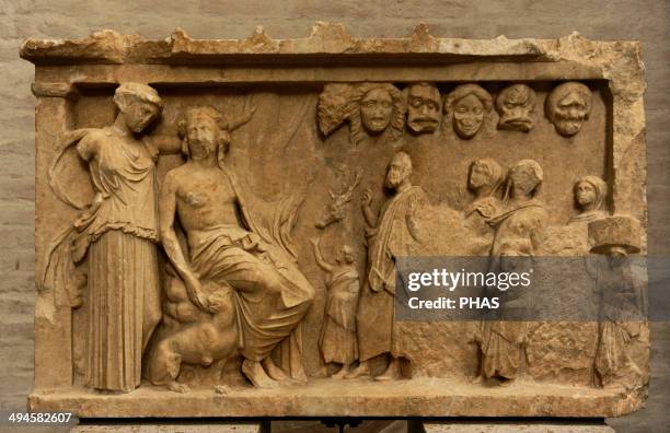 Votive stele depicting a sacrificial procession to Dionysus and Artemis for the win in a contest of theater. Votive offering, ca. 360 BC. Glyptothek....