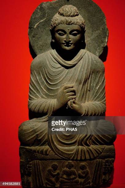 Buddha statue with dharmachakra mudra gesture. Gandhara. 2nd-3rd centuries AD. Pergamon Museum. Berlin. Germany.