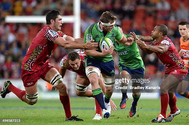 Gareth Evans of the Highlanders attempts to break through the defence during the round 16 Super Rugby match between the Reds and the Highlanders at...