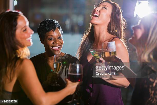 ladies night out, having fun at a bar - 4 cocktails stock pictures, royalty-free photos & images