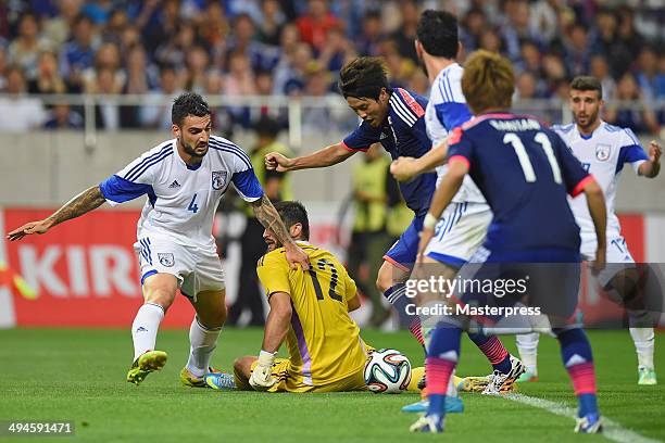 Atsuto Uchida of Japan scores his team's first goal during the Kirin Challenge Cup international friendly match between Japan and Cyprus at Saitama...