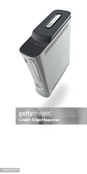 Portrait of a Microsoft Xbox 360 video game console photographed on a white background, taken on August 2, 2013.