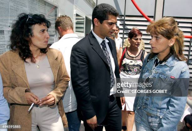 Former prostitutes Florence Khelifi known as Fanny and Christele Bourre known as Patricia leave the Toulouse court-house, 23 June 2005, where they...