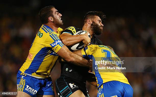 Josh Mansour of the Panthers is tackled during the round 12 NRL match between the Penrith Panthers and the Parramatta Eels at Sportingbet Stadium on...