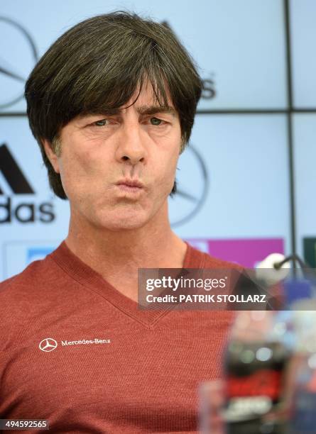 Germany's football head coach Joachim Loew answers journalists' questions during a press conference of the German national football team in San...