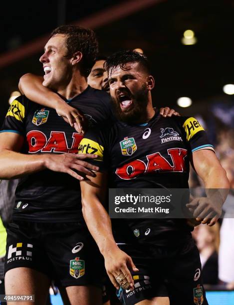 Josh Mansour of the Panthers celebrates with team mates after scoring a try during the round 12 NRL match between the Penrith Panthers and the...