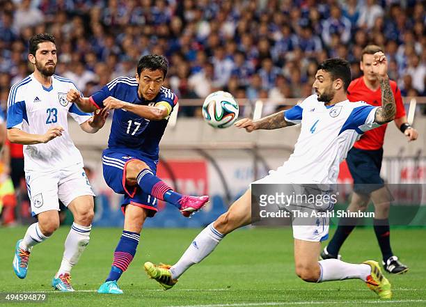 Makoto Hasebe of Japan shoots at goal during the Kirin Challenge Cup international friendly match between Japan and Cyprus at Saitama Stadium on May...