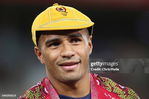 Will Genia receives his 100th game cap after the round 16 Super Rugby match between the Reds and the Highlanders at Suncorp Stadium on May 30, 2014...