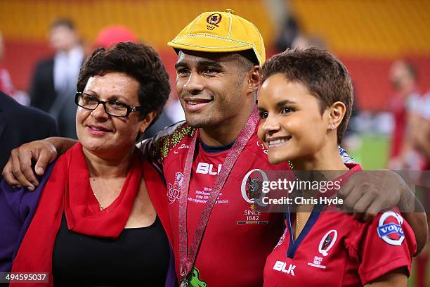 Will Genia poses with his mother Elizabeth and wife Vanessa after receiving his 100th game cap after the round 16 Super Rugby match between the Reds...