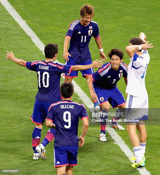 Atsuto Uchida of Japan celebrates scoring his team's first goal during the Kirin Challenge Cup international friendly match between Japan and Cyprus...