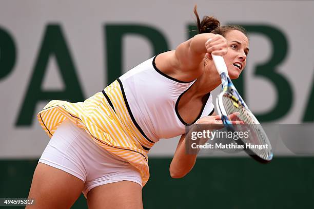 Jarmila Gajdosova of Australia serves next to her partner Janette Husarova of Slovakia during their women's doubles match against Kristina Mladenovic...