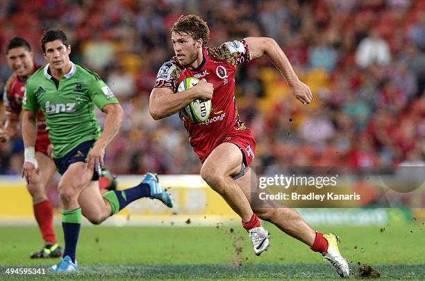 Dom Shipperley of the Reds makes a break during the round 16 Super Rugby match between the Reds and the Highlanders at Suncorp Stadium on May 30,...