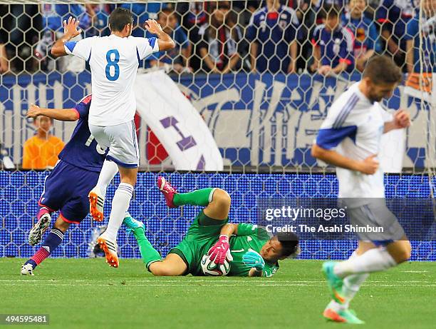 Eiji Kawashima of Japan makes a save during the Kirin Challenge Cup international friendly match between Japan and Cyprus at Saitama Stadium on May...