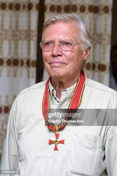 Karlheinz Boehm, German Actor and Founder of 'People for People' recieves his German Federal Cross of Merit from German Development Minister...