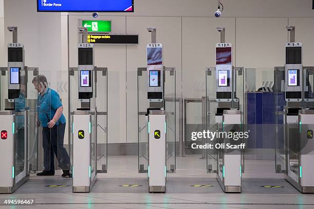 The 'ePassport gates' at Gatwick Airport's Passport Control on the UK Border on May 28, 2014 in London, England. Border Force is the law enforcement...