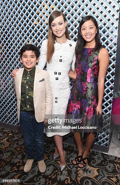 Actress Olivia Wilde poses with Madison Wallace and Trace Wallace at the opening night screening of "Suffragette" during 18th Annual Savannah Film...