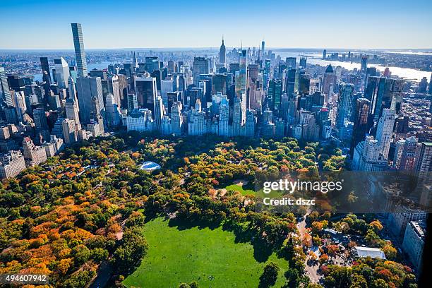 new york city skyline, central park, autumn foliage, aerial view - new york aerial stockfoto's en -beelden