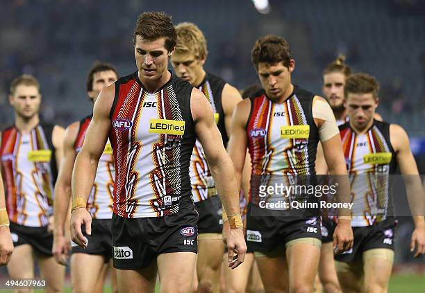 Lenny Hayes and his Saints team mates look dejected as they leave the ground after losing the round 11 AFL match between the St Kilda Saints and the...