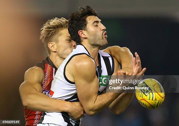 Sean Dempster of the Saints spoils a mark by Alex Fasolo of the Magpies during the round 11 AFL match between the St Kilda Saints and the Collingwood...