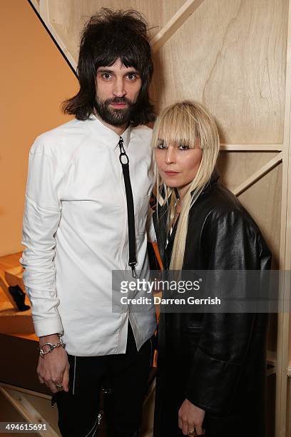 Sergio Pizzorno and Noomi Rapace attends a gala recdeption for the RCA Graduate Fashion show at Royal College of Art on May 29, 2014 in London,...