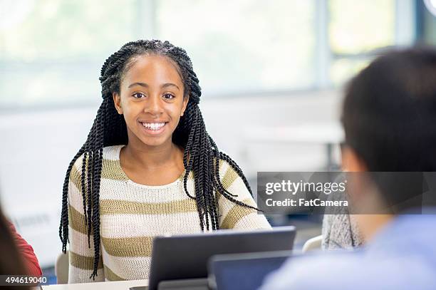 happy girl in class - female high school student stock pictures, royalty-free photos & images