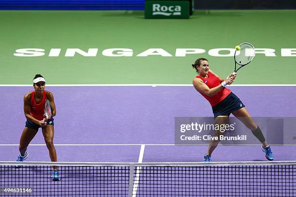 Raquel Kops-Jones and Abigail Spears of the USA in action against Timea Babos of Hungary and Kristina Mladenovic of France in a doubles round robin...